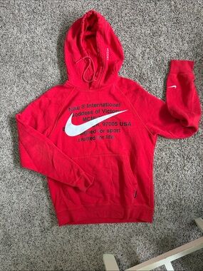 Nike Red Pullover Hoodie with Large White Swoosh and Text